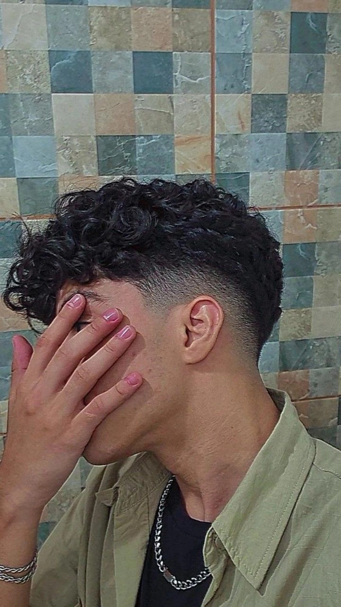 ALT: Stylish men haircut ideas for curly hair with a textured, natural look and defined volume