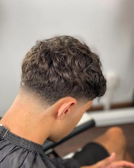 Image Title: White men hairstyle idea with a modern tapered haircut and textured finish ALT: Stylish men haircut ideas for white men featuring a clean tapered cut with textured top